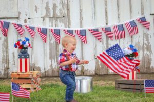 toddler with american flag
