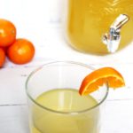 lemonade party punch in glass with glass pitcher and tangerines 1
