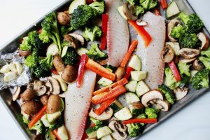 fish and veggies ready for sheet pan roasting 1