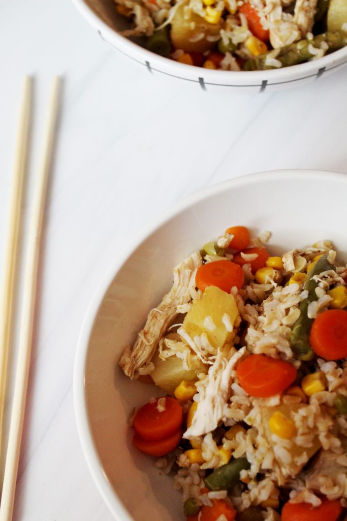 two bowls of slow cooker chicken fried rice