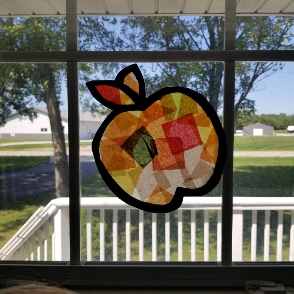 apple suncatcher on window