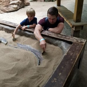 dad and kid being archaeologists