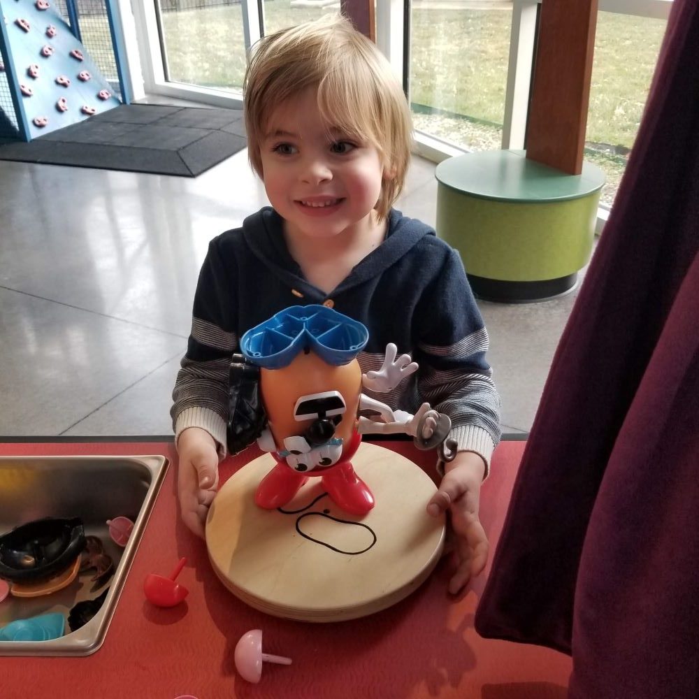 boy playing at children's museum